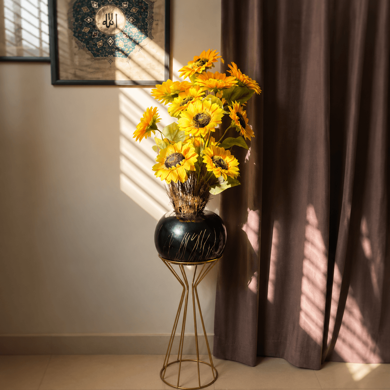 sunflower arrangement in black chalk bowl